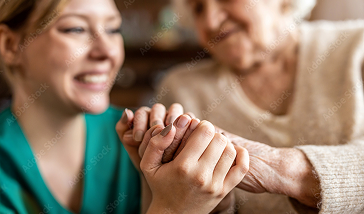 Therapist guiding a senior in drawing, illustrating consistent assessment.